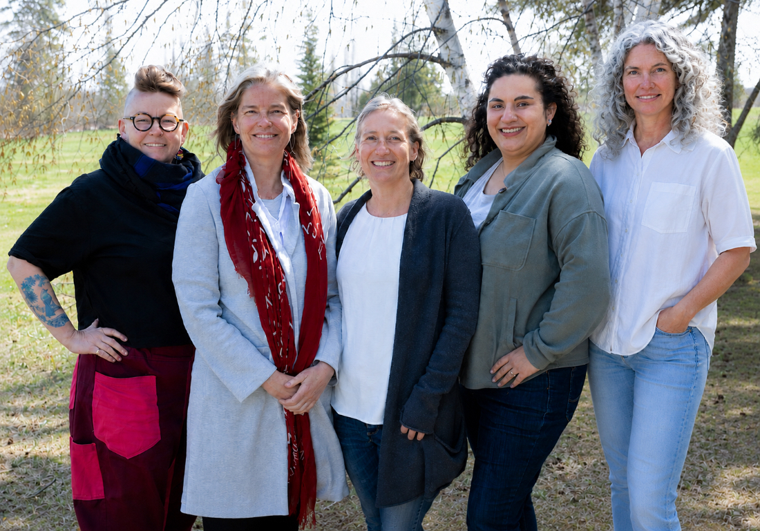 Group portrait of birth professionals gathered outdoors, showcasing the collaborative community of Edmonton doulas and midwives.