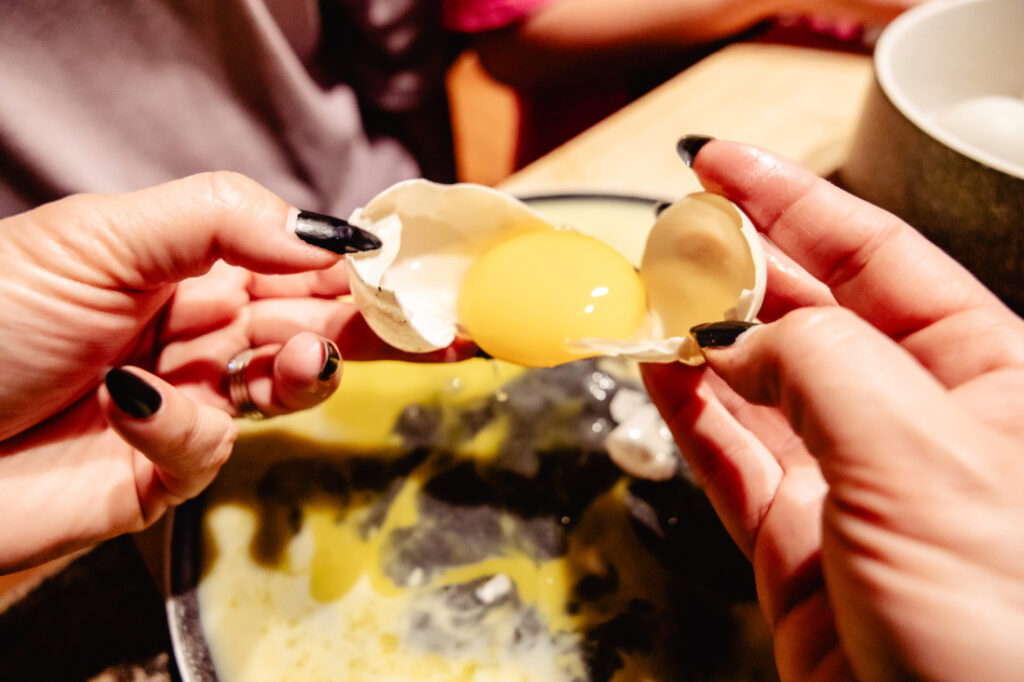 A close-up of a non-viable duck egg with only a yolk inside, showing one of the natural outcomes we experienced while hatching duck eggs.